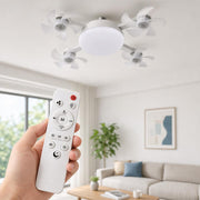 Included remote control with LumiBreeze fan light in the background
